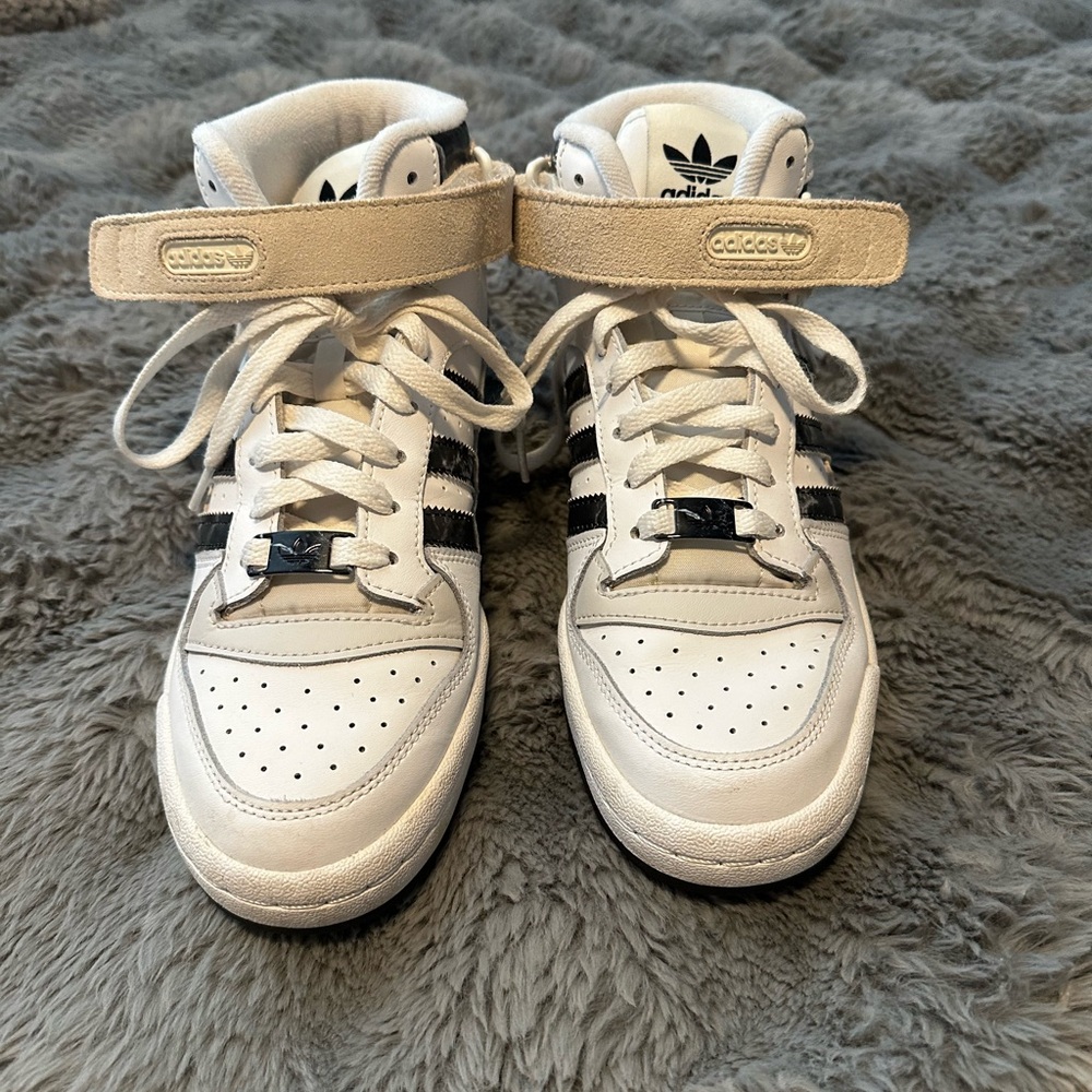 Adidas women’s Forum Mid sneakers in the "White Black" colorway.